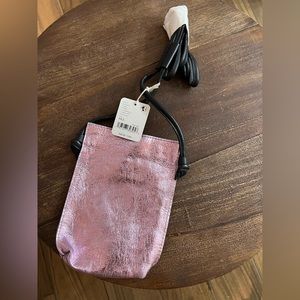Free People Crossbody style, metallic leather fabrication, pouch design.
